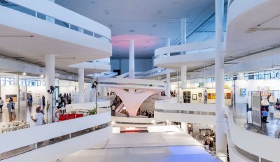 SP-Arte art fair with various gallery booths in São Paulo's iconic Bienal Pavilion.